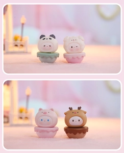 Detail shot of cute panda and puppy tumbler ornaments on macaron bases for desk decor