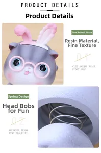 Detail view of cat resin ornament with spring head-shaking structure and cute rabbit ears