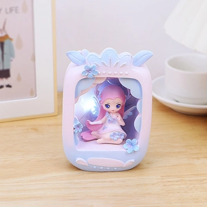 Detail of flower fairy night light with warm LED glow and delicate resin floral decor