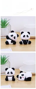 Detailed close-up of cute panda figurines in various sitting poses on a wooden desk