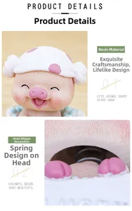 Détail d'un ornement de bureau en forme de cochon avec tête à ressort et résine