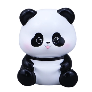 Cute sitting panda figurine with a playful expression for desktop or car interior decor