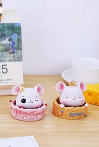 Close-up of cute resin mouse figurines on Sweet bases for desk or car dashboard decor