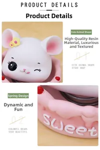 Close-up of a cute resin mouse ornament with a shaking spring head and sweet base