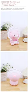 Detailed back view showing coin slot and premium vinyl texture of pink bear bank