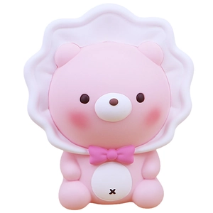 Pink cartoon bear squishy toy with white lace hood and bow tie on white background
