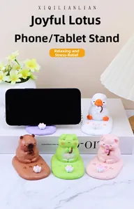 Detail of four cute resin animal phone stands featuring mosaic texture and lotus base