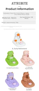Close-up of resin animal phone stands featuring duck, frog, and pig styles for desks
