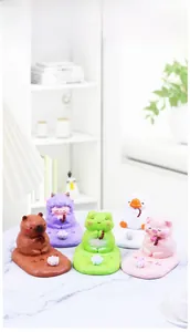 Macro shot of 5 cute resin animal phone stands with lotus base and healing vibes