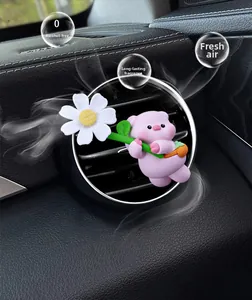 Pink cartoon pig car air vent clip diffuser detail with white daisy flower ornament
