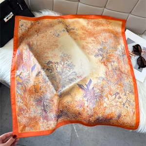 Detailed jungle floral print on premium silk scarf with vibrant orange hand-rolled edges