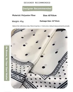 Detail view of 65x65cm black and white polka dot silk-feel scarf with vintage border