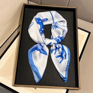Elegant shell print silk scarf in blue and white with marine starfish coral patterns