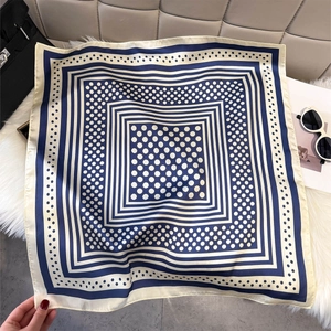 Navy blue and beige polka dot square silk scarf with geometric border and glossy finish