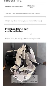 Detailed specs of camellia silk scarf 53x53cm 22g shown on a black leather bag