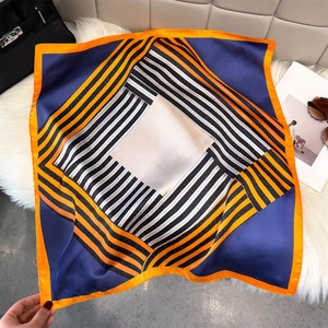 Satin square scarf with geometric stripes styled with luxury handbag and sunglasses