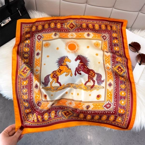 Luxurious horse print silk-like square scarf in orange and yellow with elegant sun motifs