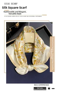 Detailed view of the olive leaf print on a white mulberry silk square scarf