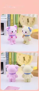 Front and back detail of cute resin bear figurine with bow tie and heart pendant decor