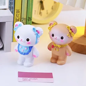 Cute cream bear desk ornaments in white and peach colors with colorful bow accessories