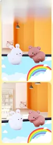 Close-up of cute cartoon bunny and bear figurines for computer monitor or desk decoration