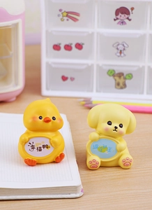 Macro detail of cute resin duck and puppy figurines with healing messages for desktop
