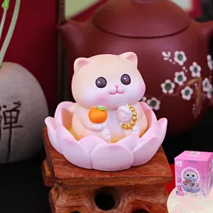 Zen cute cat figurine on pink lotus base with persimmon symbol and gift packaging