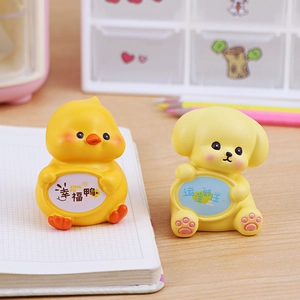 Cute cartoon animal figurines of a yellow chick and dog for office desk decor