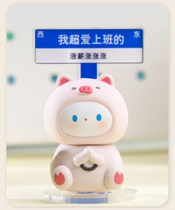 Macro detail of Cinnamoroll figurine in pig outfit wishing on office desk stand