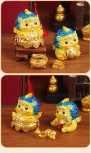 Detailed view of four yellow lucky Pixiu resin figurines with blue gradient manes for desk