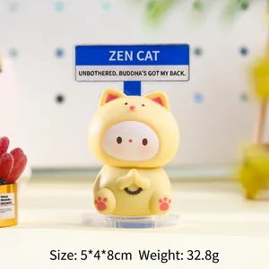 Cute yellow cat figurine with blue street sign on acrylic base for desk decor