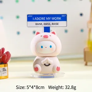 Pink pig figurine desk ornament with blue street sign, warm aesthetic for office decor