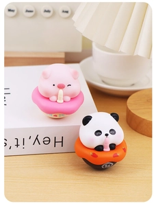 Close-up of cute panda and pig tumblers for desk decor and stress relief toy