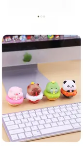 Set of four cute animal tumbler figurines including pig and capybara on a desk