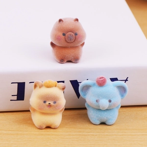 Mini flocked animal figurines featuring a pig, dog, and elephant for desk decor