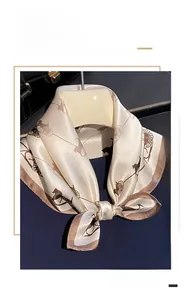 Detail of premium mulberry silk square scarf with classic brown carriage print pattern