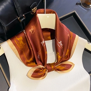 Luxurious carriage print silk scarf in rust red with gold borders for elegant women