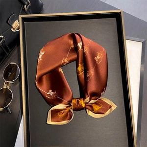 Elegant 100% mulberry silk scarf featuring golden carriage prints on dark brown base