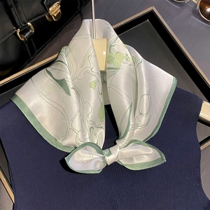 Elegant 100% mulberry silk square scarf with green floral print tied in a bow