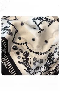 Close-up of leopard and floral print on 100% mulberry silk scarf with fine stitching