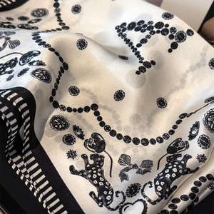 Elegant 100% mulberry silk square scarf featuring leopard and floral print in black and white