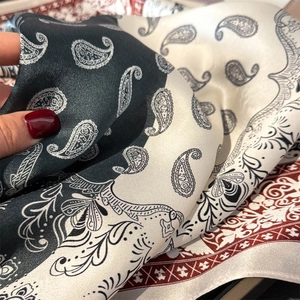 Satin neck scarf featuring vintage paisley print in black and beige with a silky drape