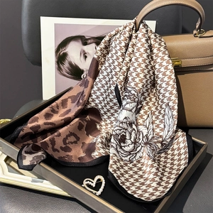 Elegant silk scarf with leopard print, houndstooth, and floral patterns in brown and white