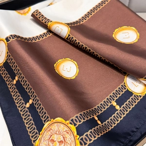 Detail of vintage baroque silk scarf featuring golden chains and lion head medallion