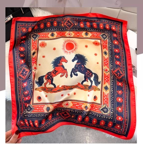 Detail of horse print silk scarf featuring bohemian patterns and geometric borders