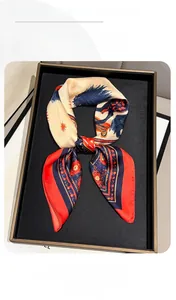 Detail view of the luxury horse print silk scarf with satin finish and vibrant colors