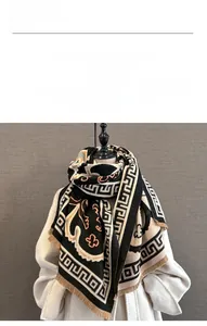 Close-up of soft imitation cashmere scarf fabric with vintage patterns and tassels