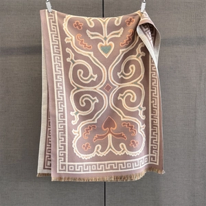 Detailed close-up of retro pink jacquard scarf with heart motifs and tassel fringe