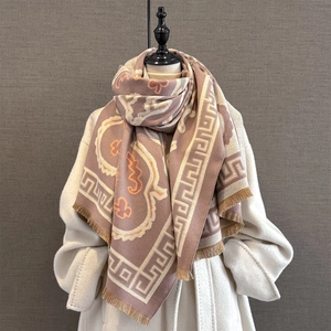 Detail of pashmina scarf with Greek fret border and paisley floral pattern tassels
