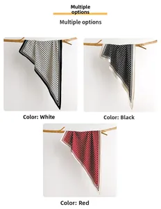 Detailed macro view of vintage polka dot scarves in white black and red silk texture